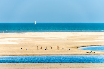 Fototapeta premium Boys playing soccer on the beach