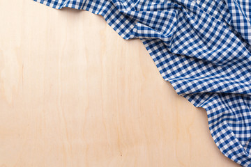 checkered tablecloth on wooden table