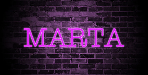 Fototapeta na wymiar first name Marta in pink neon on brick wall