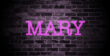 first name Mary in pink neon on brick wall