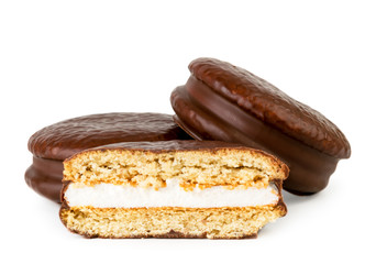 Chocolate biscuit sandwich and half on a white, isolated.