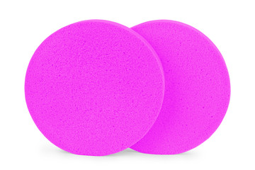 Two beige round cosmetic sponge pads for face make-up cleaning, one frontal and one side view,...