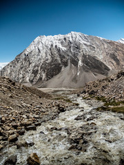 Small River flowing with Himalayan Mountain in Background