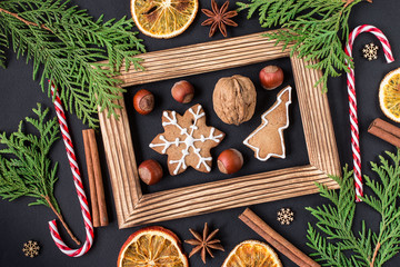 Christmas wooden background with gingerbread cookies. Top view
