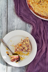 cake with blueberry jam on wooden background