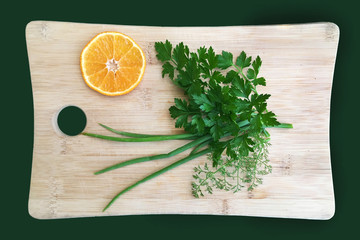 Board for cutting with greens and orange