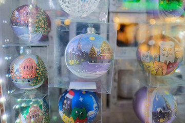 Christmas balls on a show-window of shop.