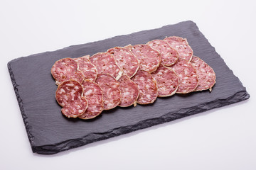 Saucisson sec delicious french salami on a white background