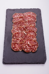 Saucisson sec delicious french salami on a white background