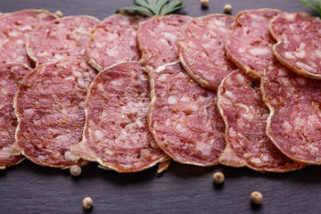 Saucisson sec delicious french salami on a wooden background