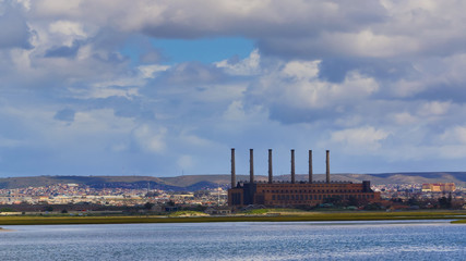 Factory in an industrial area next to a river