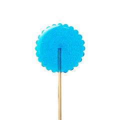 transparent blue lollipop on a wooden stick on a white background