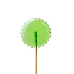 transparent green lollipop on a wooden stick on a white background