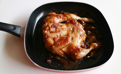 Ayam ungkep. Chicken is cooked in spices prior to deep frying. Can be grilled too. Popular dish in Indonesia.