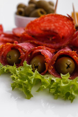 delicious sliced salami on a white background