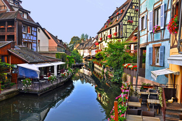 medieval houses on the banks of river in colmar city france.