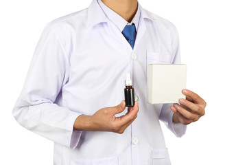 Asian doctor or scientist hand holding spuit, dropping pipet, pipette, medicine, brown glass container eye dropper with white box at laboratory isolated on white.