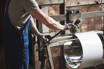 Portrait of a young master working at a factory.