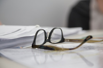 Glasses on printed pages