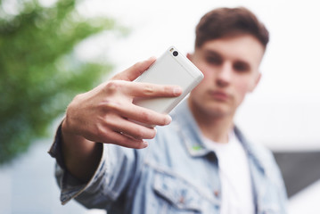 photo of a young man before an exciting trip at the airport