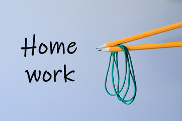 Two pencils with rubber bands.