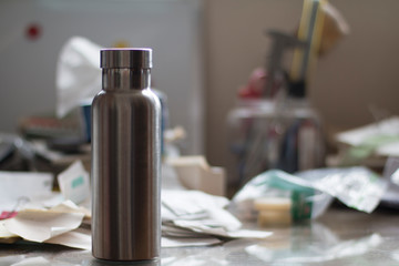 Insulated Stainless Bottle on a dirty office desk