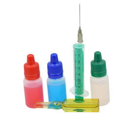 Medical syringe and vials isolated on white