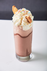 Cold chocolate milkshake frappe in glass