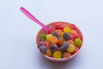 whale with colored jelly beans - jujubas in Portuguese - and white background