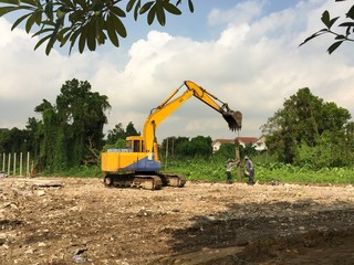 digger at construction site, worker at working time