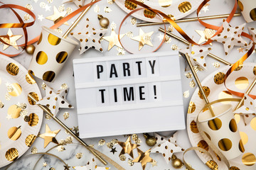Party time lightbox celebration message with luxury gold party decorations