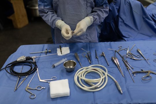 Surgeon holding medical tools in hospital
