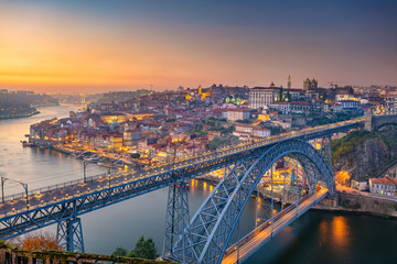 Porto, Portugal. Cityscape image of Porto, Portugal with the famous Luis Bridge and the Douro River during sunset. - obrazy, fototapety, plakaty