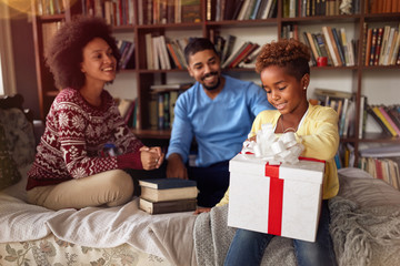 Family surprising daughter with a Christmas present..