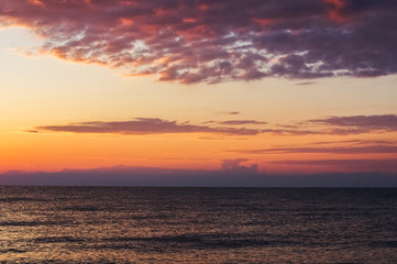 Morning sunrise on the horizon of Aegean sea.