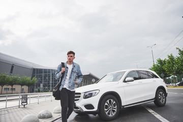 photo of a young man before an exciting trip at the airport.