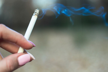 Young woman enjoying a cigarette