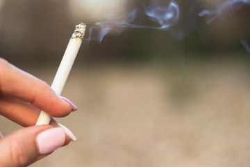 Young woman enjoying a cigarette