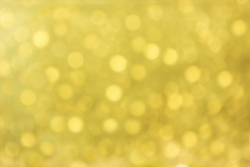 Obraz premium Lights on gold with star bokeh background.
