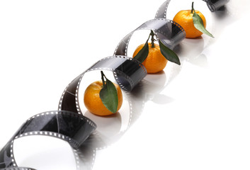 Old photographic film in a roll on a light background. Christmas or New Year's decor. The concept...