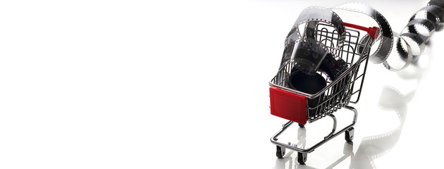 Old photographic film in a roll on a light background. The concept of history, home archives, memorable dates. Selective focus, close-up.