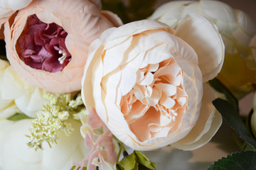 Beautiful artificial flowers like roses and peonies, great background for wedding, Valentine's day, holiday, birthday, beautiful delicate composition