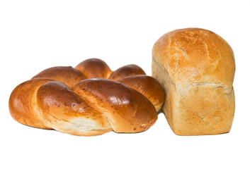 Round challah and a loaf of white bread are isolated on a white background. white bread loaf isolated. Loaf of bread isolated on white background