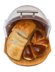 Open plastic breadbox with bread and Round challah isolated on white background. a loaf of white bread and a round challah in a breadbox on a white background - obrazy, fototapety, plakaty