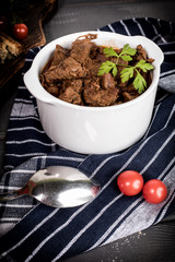 Beef meat stew in ceramic pot.