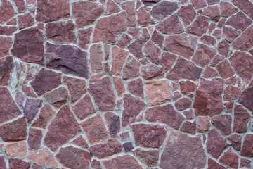 Texture backgrounds are a natural red stone on the wall