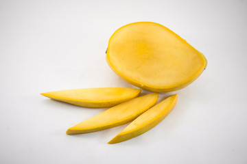 Yellow mango and mango slices isolated white background