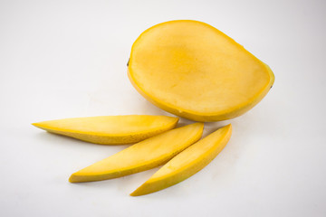Yellow mango and mango slices isolated white background