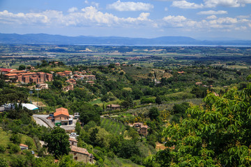 Fototapeta na wymiar Panoramic aerial view near the medieval town of Montepulciano in a sunny summer day, Tuscany, Italy. Holidays in Italy.