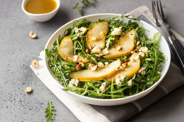 Arugula, gorgonzola cheese, caramelized pear and nut salad. Healthy food. Light breakfast, lunch or dinner. 